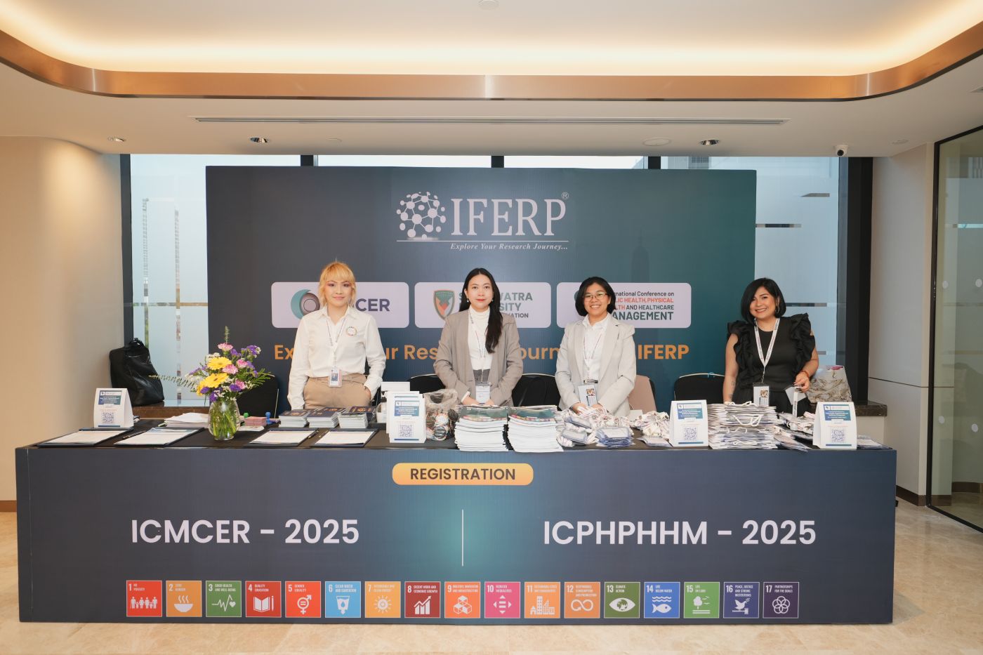 The ICMCER-2025 registration desk in Bangkok, backed by the seventeen Sustainable Development Goals